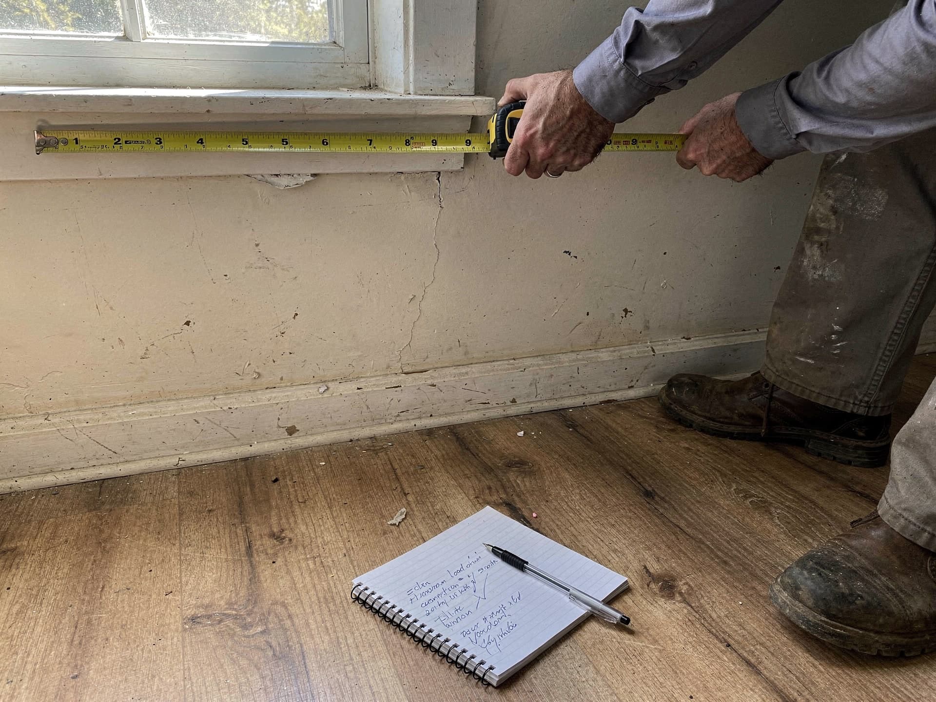 The owner measuring a room for the load calculation
