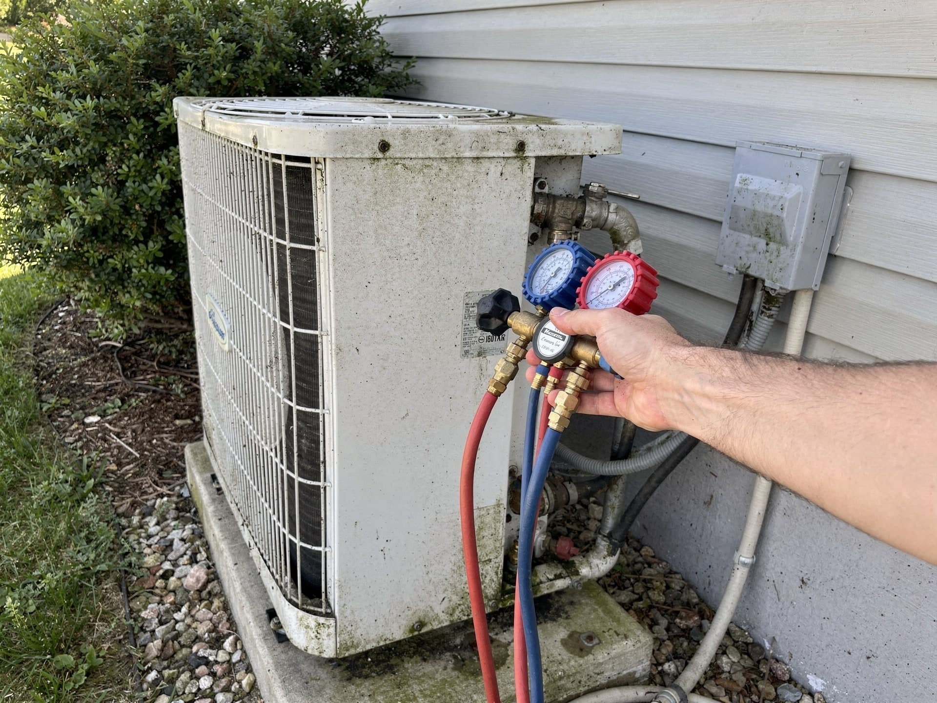 The owner testing the finished system to confirm it heats and cools